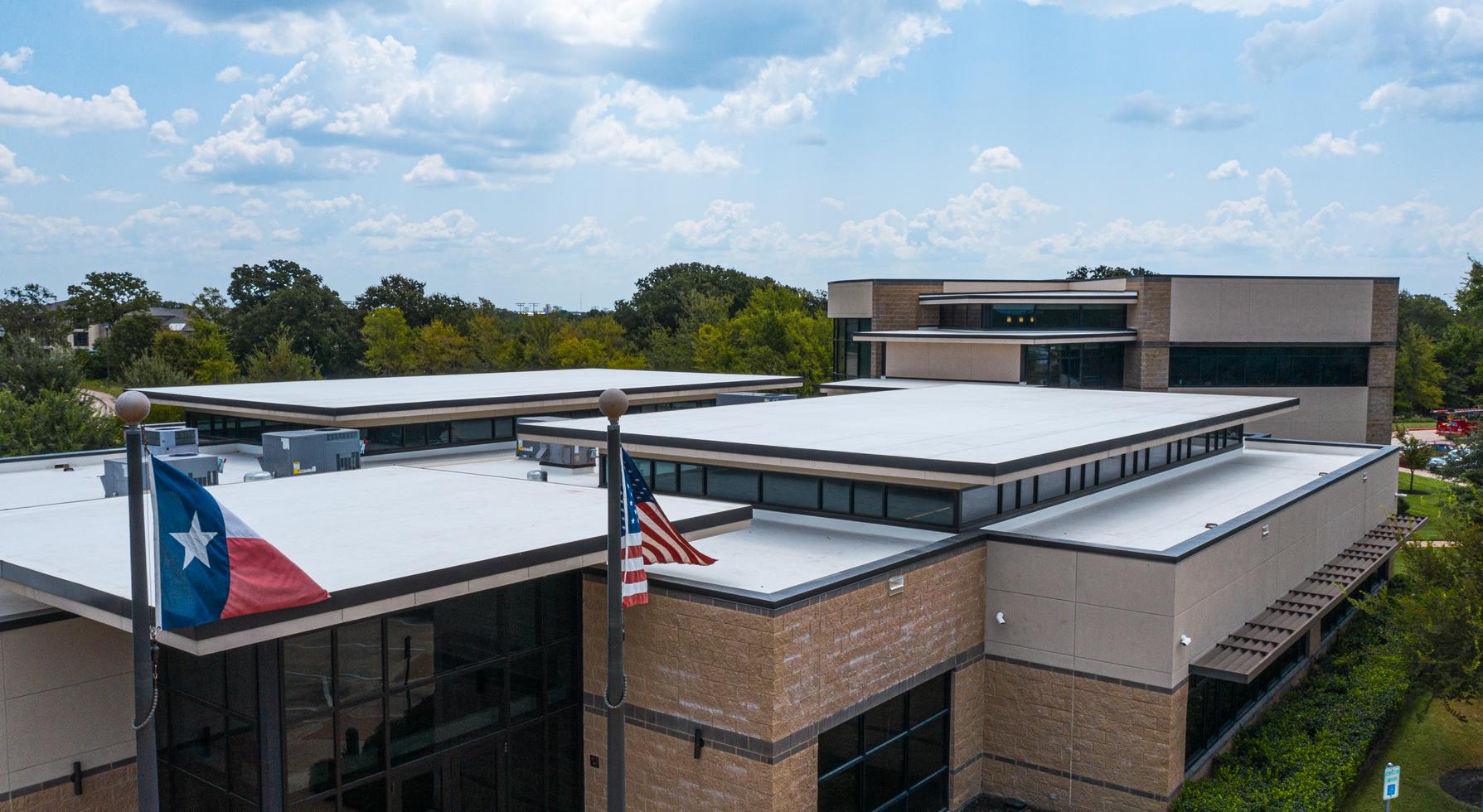 A San Antonio roofing company designed and built this white seven tier commercial flat roof.