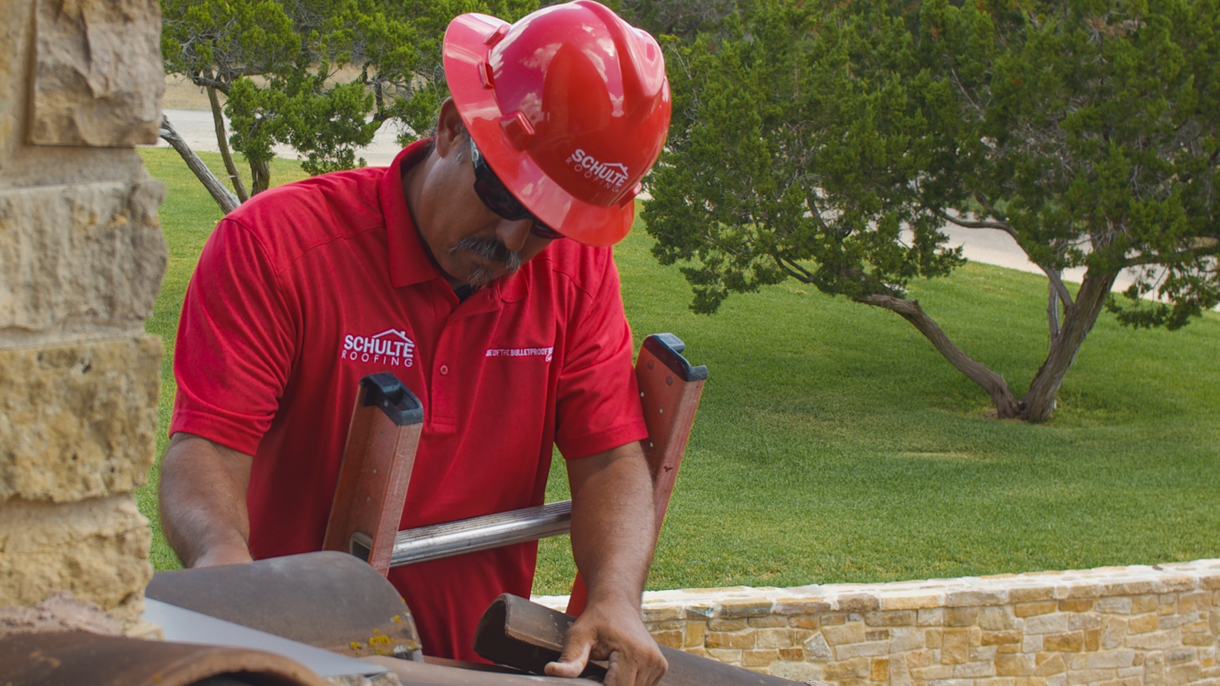 A San Antonio roofer from Schulte Roofing® checking the build and installation quality of a roof.