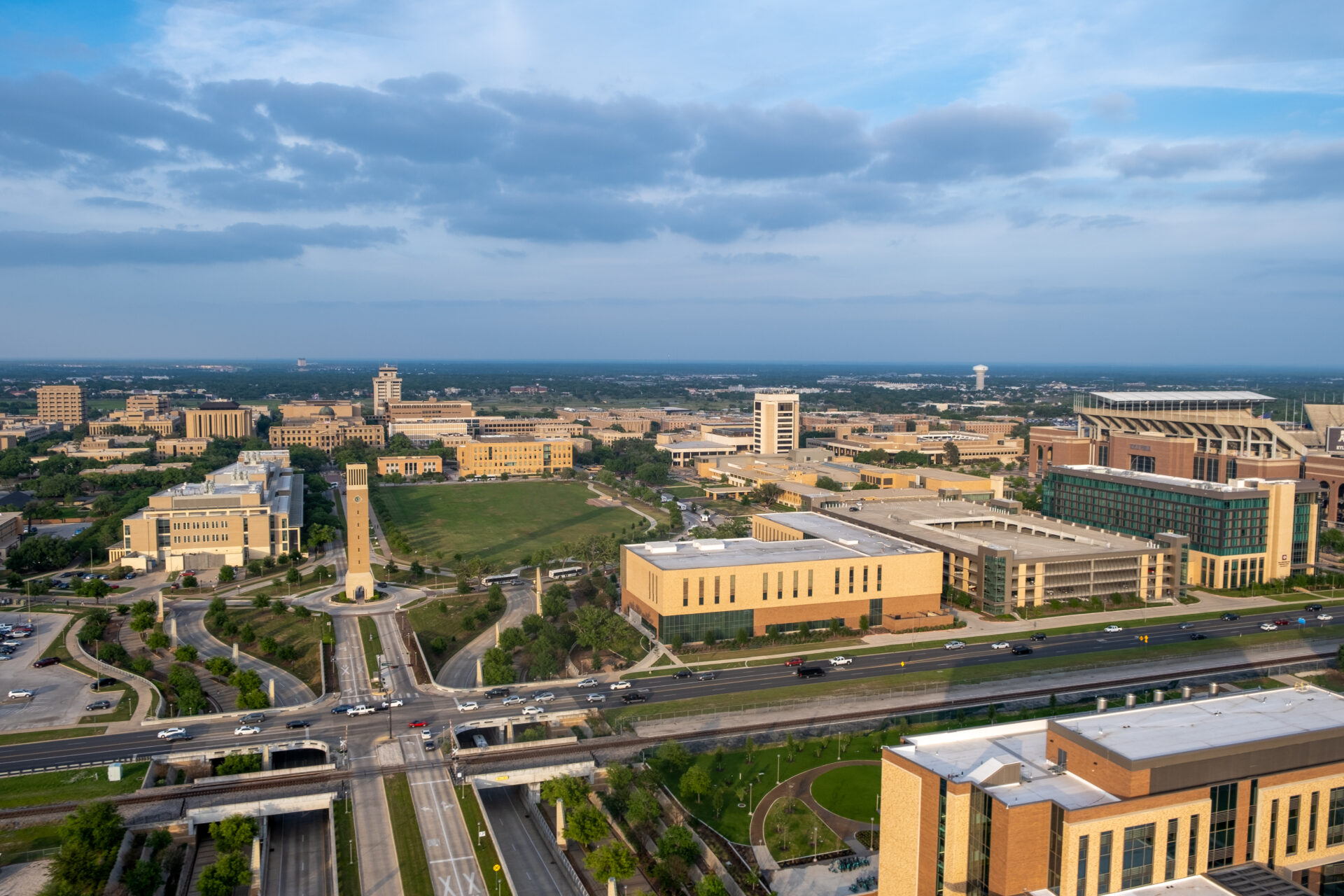 21st Century Classrooms with Commercial Roof completed by Schulte Roofing with Texas AM campus in the background