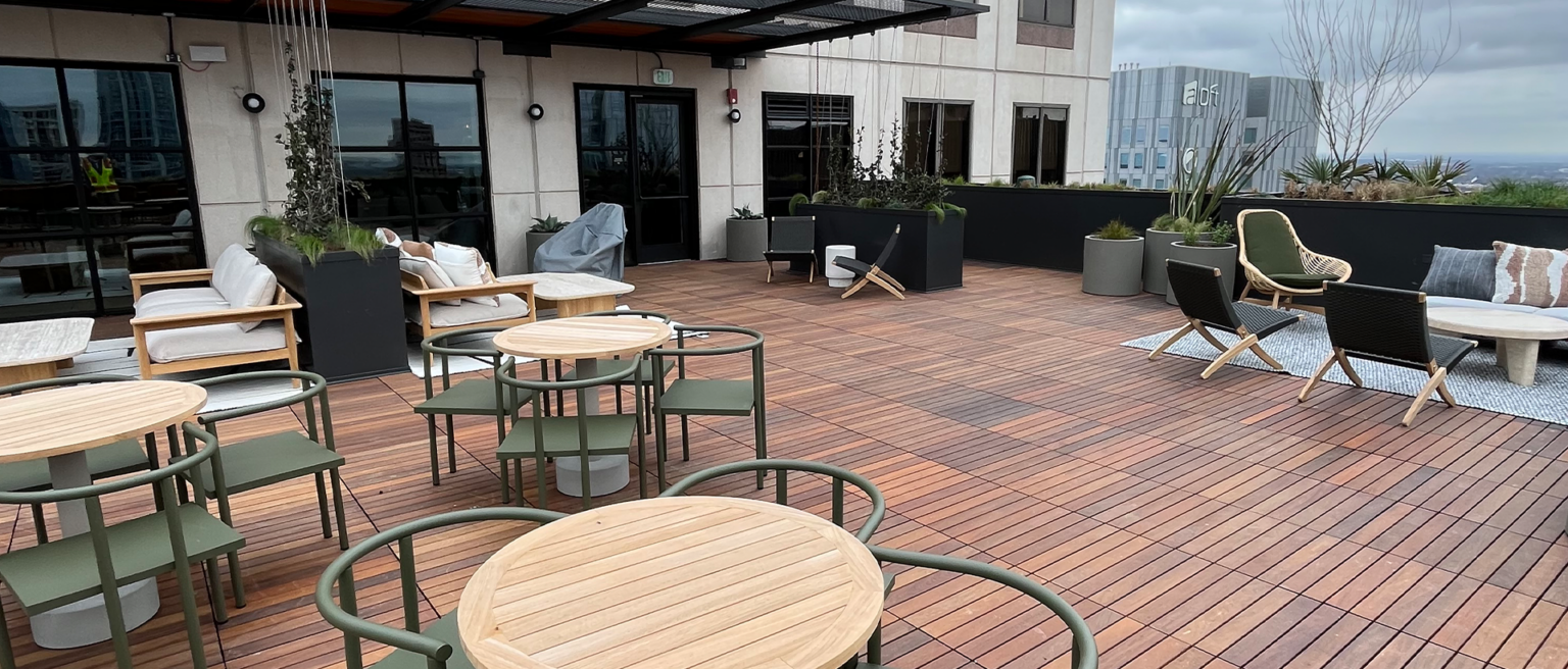 Architectural details, including a metal sunscreen shade and eyebrow window, on the 600 Congress rooftop in Austin by Schulte Roofing.