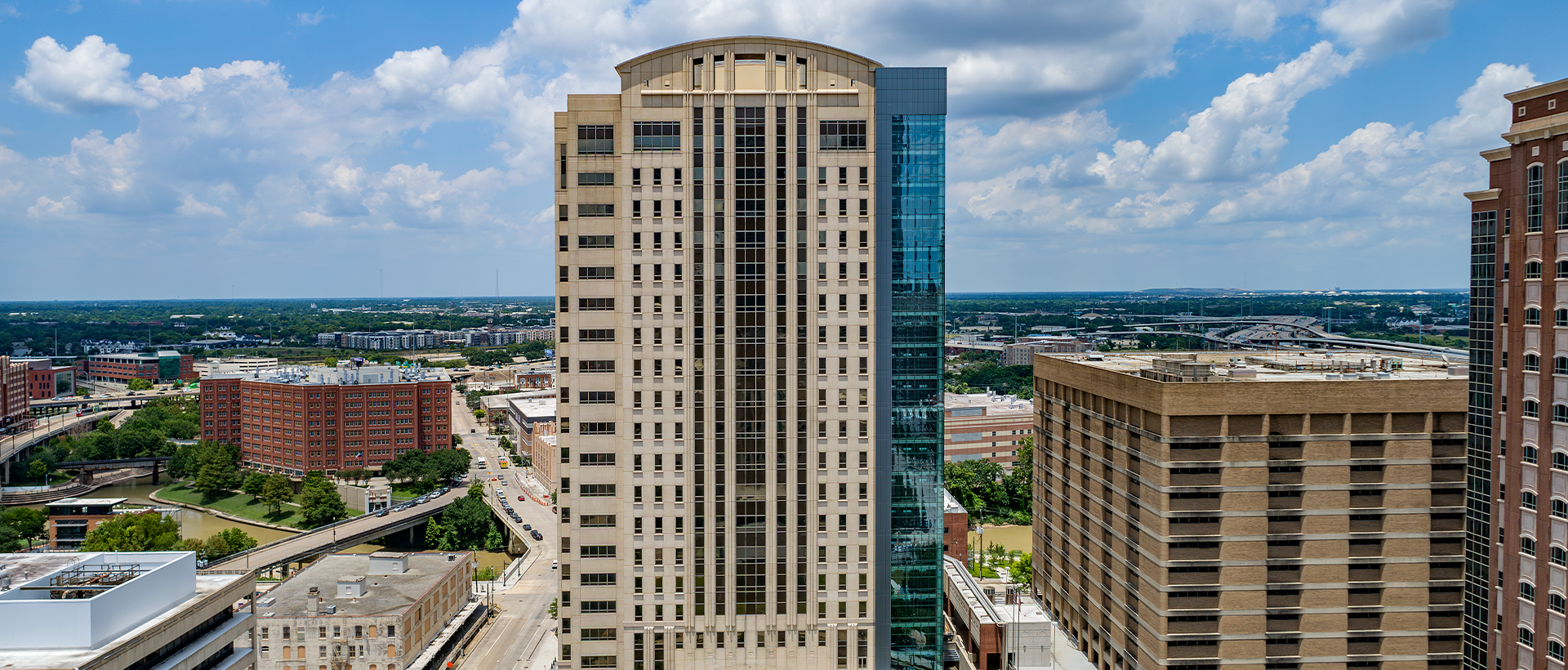 The Texas Department of Public Safety's Criminal Justice Center with views over looking the city. Membrane and commercial roofing completed by Schulte Roofing.